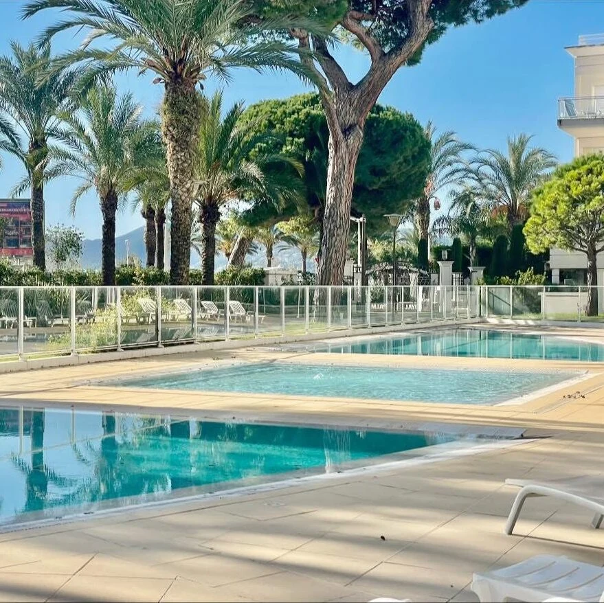 Pool and gardens of the Royal Palm residence in Cannes